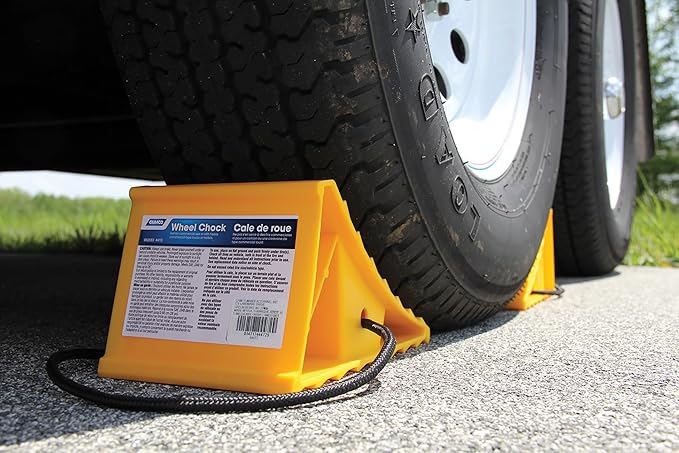 Camco Standard Wheel Chock w/Rope for Trailers - Heavy Duty RV Wheel Chock Constructed of Durable Plastic w/UV inhibitors - Features Rope Handle for Easy Removal - Use w/Tires Up to 26-in - 44472
