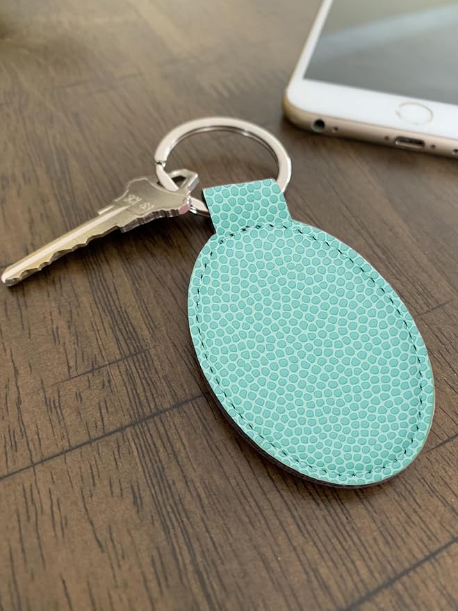 LaserGram Oval Keychain, Golfer Golfing, Personalized Engraving Included (Basketball Teal)