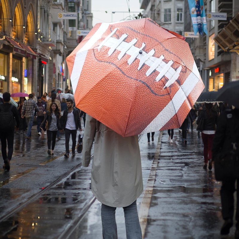 Storm Duds Ultra-Water Resistant Football Umbrella - 42” Coverage w/Molded Handle and Wrist Strap - Flexible, Wind & Rust Resistant Folds to 15.5 Inches